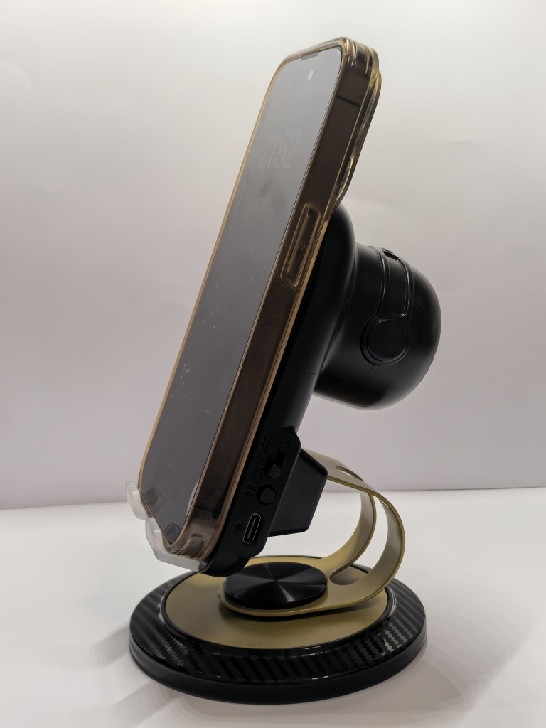 Phone holder with wireless speaker